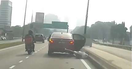 MALAYSIAN TAXI DRIVER UNDER INVESTIGATION AFTER PASSENGER LEAPS FROM MOVING VEHICLE