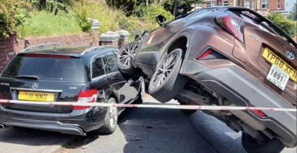 TAXI LANDS ON TOP OF PARKED CARS IN DRAMATIC NEWPORT ROAD CRASH